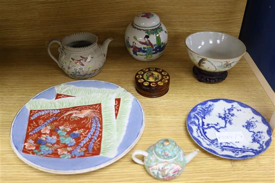 A small group of Chinese and Japanese ceramics including a miniature teapot, 6cm
